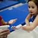 Six-year-old Faith Falzon chalks up her hands on Monday, January 28. Daniel Brenner I AnnArbor.com